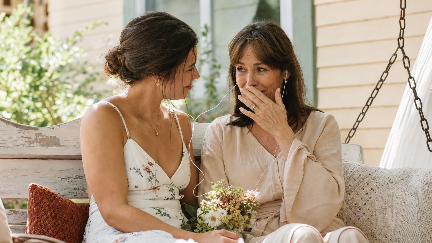 A mother on a porch swing realising the song is about her
